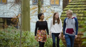 Students walking though woodland