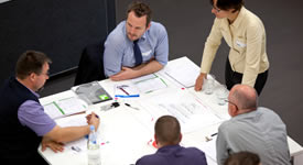 Mathematics students and lecturer tutorial