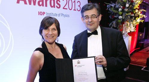 Dr Laura Kormos and Prof Peter Ratoff with the Department of Physics' Juno Champion award.