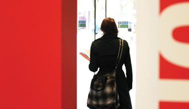 Lancaster student walking out of the building